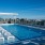 tanning shelf with chairs in swimming pool