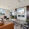 sitting area in front of fireplace and wall mounted tv in clubhouse