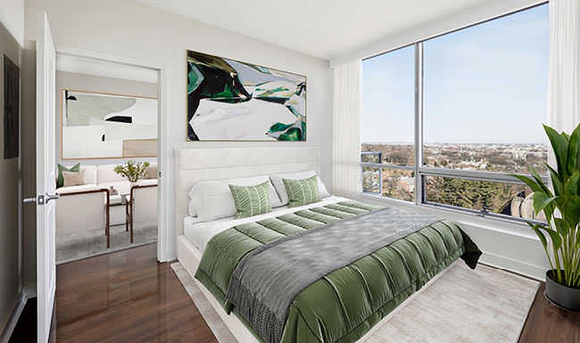 picture windows surround living and dining areas in apartment